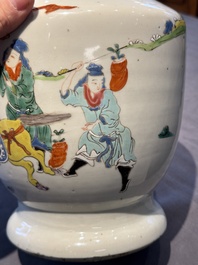 A Chinese famille rose 'riders on horseback' vase and a wooden cover, Yongzheng/Qianlong