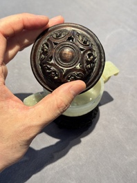 A Chinese white jade bowl with ruyi-shaped handles, wooden cover and stand, 18/19th C.