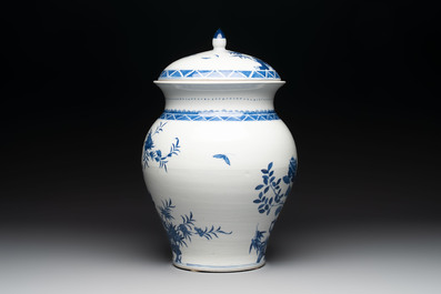 A Chinese blue and white 'birds among flowering branches' vase and cover, 19th C.