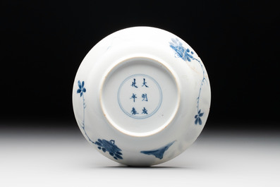 A Chinese blue and white 'Sense of Smell' plate and an 'Amorous Shepherds' plate, Kangxi