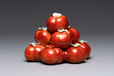 A pair of Chinese polychrome 'persimmons' groups on wooden stands, 19th C.