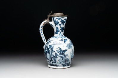 A blue and white Dutch Delft ewer with a mounted pewter lid, 17th C.