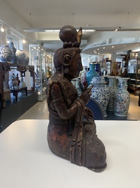 A Chinese gilt-lacquered wooden sculpture of Buddha, 18/19th C.