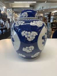 A pair of Chinese blue and white bronze-mounted vases and a covered jar, 19th C.