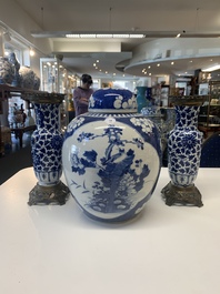 A pair of Chinese blue and white bronze-mounted vases and a covered jar, 19th C.