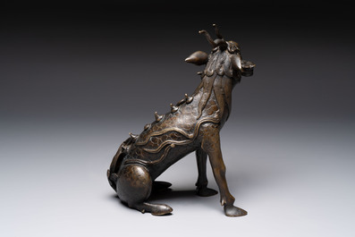 A fine Chinese bronze incense holder in the form of a qilin, Ming