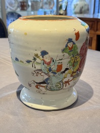 A Chinese famille rose 'riders on horseback' vase and a wooden cover, Yongzheng/Qianlong