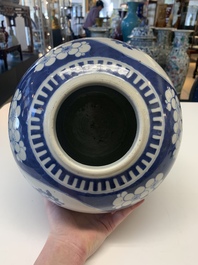 A pair of Chinese blue and white bronze-mounted vases and a covered jar, 19th C.