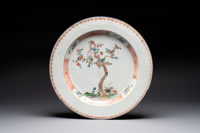 A Chinese wucai jar and cover, a famille verte vase, a dish and three plates, Kangxi