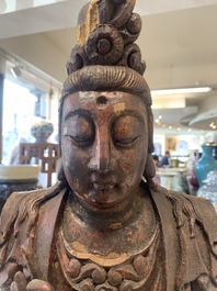 A Chinese gilt-lacquered wooden sculpture of Buddha, 18/19th C.