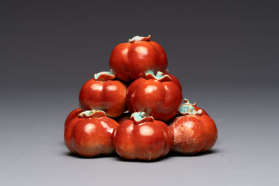 A pair of Chinese polychrome 'persimmons' groups on wooden stands, 19th C.