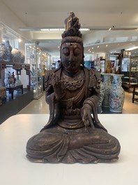 A Chinese gilt-lacquered wooden sculpture of Buddha, 18/19th C.