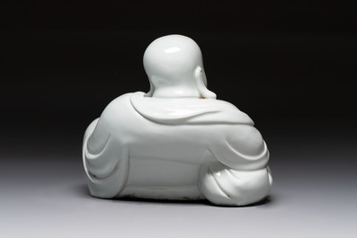 A Chinese famille rose Milefo Buddha and a white-glazed Milefo Buddha, 19th C.