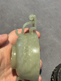 A Chinese white jade bowl with ruyi-shaped handles, wooden cover and stand, 18/19th C.