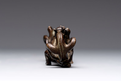 A Chinese bronze 'dragon' brush rest, Song/Yuan