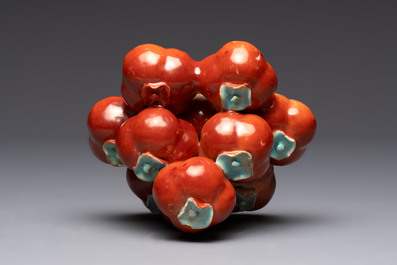 A pair of Chinese polychrome 'persimmons' groups on wooden stands, 19th C.