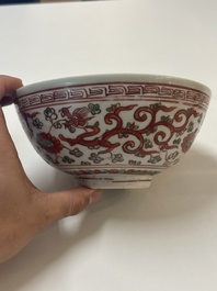 A Chinese wucai 'dragon and phoenix' bowl, Shi 石 mark, Transitional period