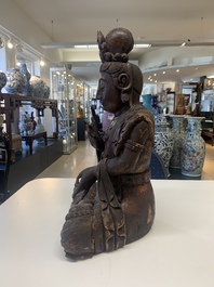 A Chinese gilt-lacquered wooden sculpture of Buddha, 18/19th C.