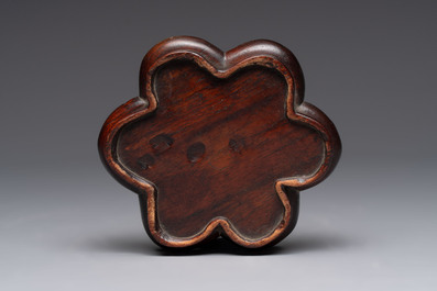 A pair of Chinese polychrome 'persimmons' groups on wooden stands, 19th C.