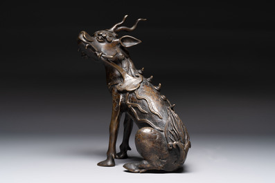A fine Chinese bronze incense holder in the form of a qilin, Ming