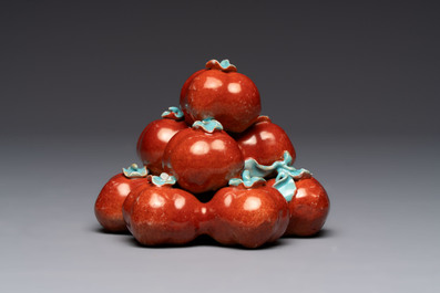 A pair of Chinese polychrome 'persimmons' groups on wooden stands, 19th C.