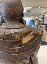 A Chinese gilt-lacquered wooden sculpture of Buddha, 18/19th C.