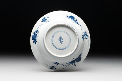 A Chinese blue and white 'Sense of Smell' plate and an 'Amorous Shepherds' plate, Kangxi