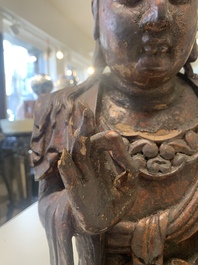 A Chinese gilt-lacquered wooden sculpture of Buddha, 18/19th C.