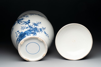 A Chinese blue and white 'birds among flowering branches' vase and cover, 19th C.