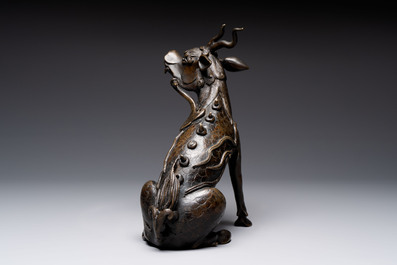 A fine Chinese bronze incense holder in the form of a qilin, Ming