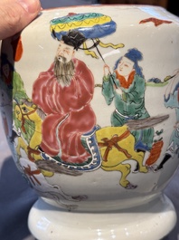 A Chinese famille rose 'riders on horseback' vase and a wooden cover, Yongzheng/Qianlong
