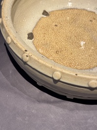 A large Chinese cream-glazed drum-shaped basin, Ming