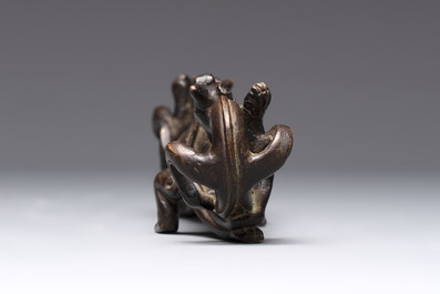 A Chinese bronze 'dragon' brush rest, Song/Yuan