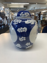 A pair of Chinese blue and white bronze-mounted vases and a covered jar, 19th C.