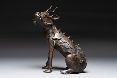 A fine Chinese bronze incense holder in the form of a qilin, Ming