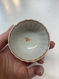Eight Chinese Canton famille rose cups, 14 saucers and a teapot, Qianlong