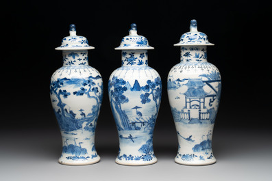 A Chinese blue and white garniture of five vases with landscape design, 19th C.