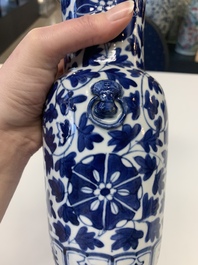 A pair of Chinese blue and white bronze-mounted vases and a covered jar, 19th C.