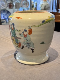 A Chinese famille rose 'riders on horseback' vase and a wooden cover, Yongzheng/Qianlong