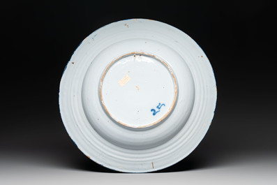 A blue and white 'figures in a garden' chinoiserie dish, Frankfurt, 17th C.