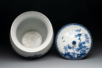 A Chinese blue and white 'birds among flowering branches' vase and cover, 19th C.