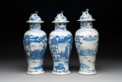 A Chinese blue and white garniture of five vases with landscape design, 19th C.