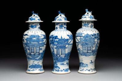 A Chinese blue and white garniture of five vases with landscape design, 19th C.