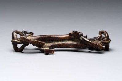 A Chinese bronze 'dragon' brush rest, Song/Yuan