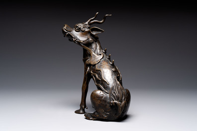 A fine Chinese bronze incense holder in the form of a qilin, Ming