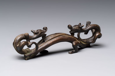 A Chinese bronze 'dragon' brush rest, Song/Yuan