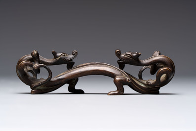 A Chinese bronze 'dragon' brush rest, Song/Yuan