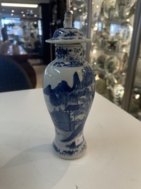 A Chinese blue and white garniture of five vases with river landscapes, 19th C.