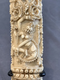 A Tibetan carved bone apron ornament with a dakini, 19th C.