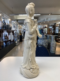 Three Chinese Dehua blanc de Chine figures of Guanyin and a monk, He Chaozong 何朝宗 and Dehua 德化 mark, 20th C.